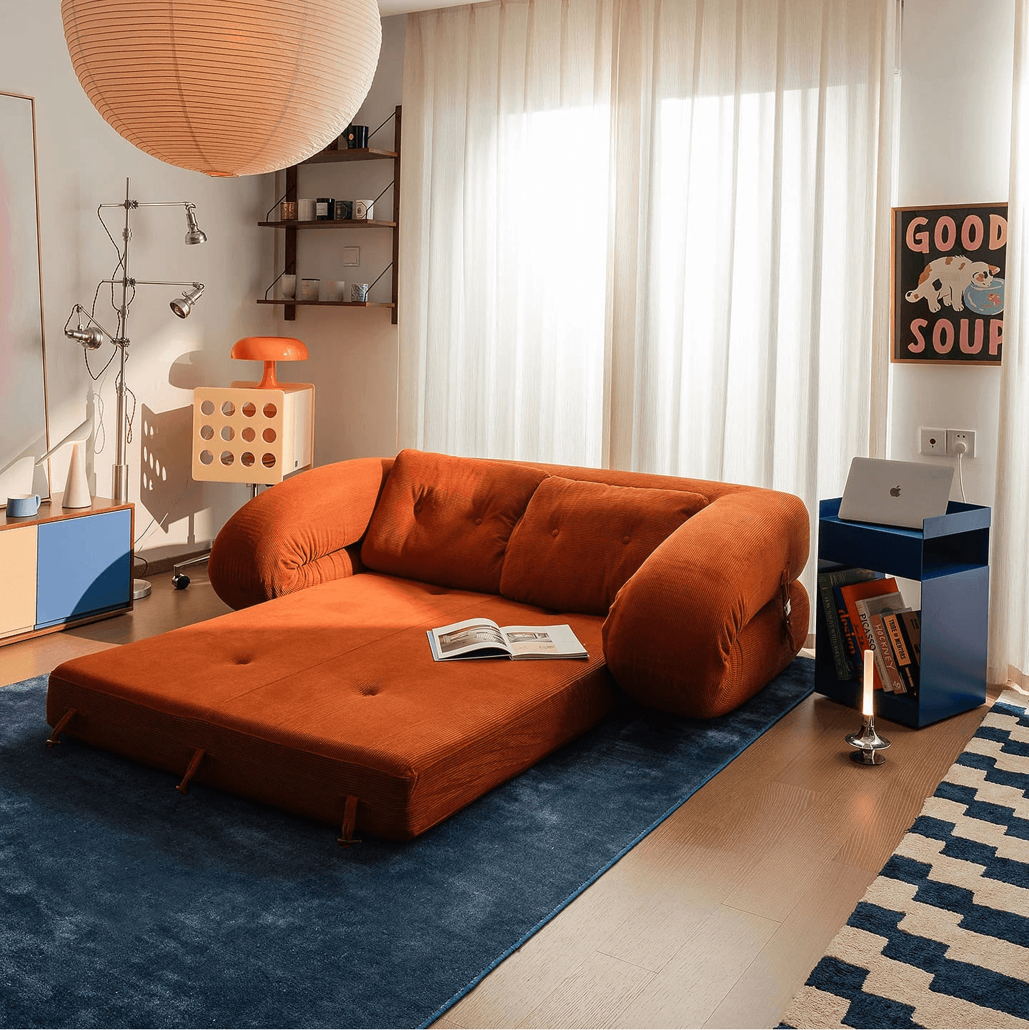 Flippo Sofa Bed in Orange color – sculptural design with plush corduroy, convertible to bed, modern furniture style